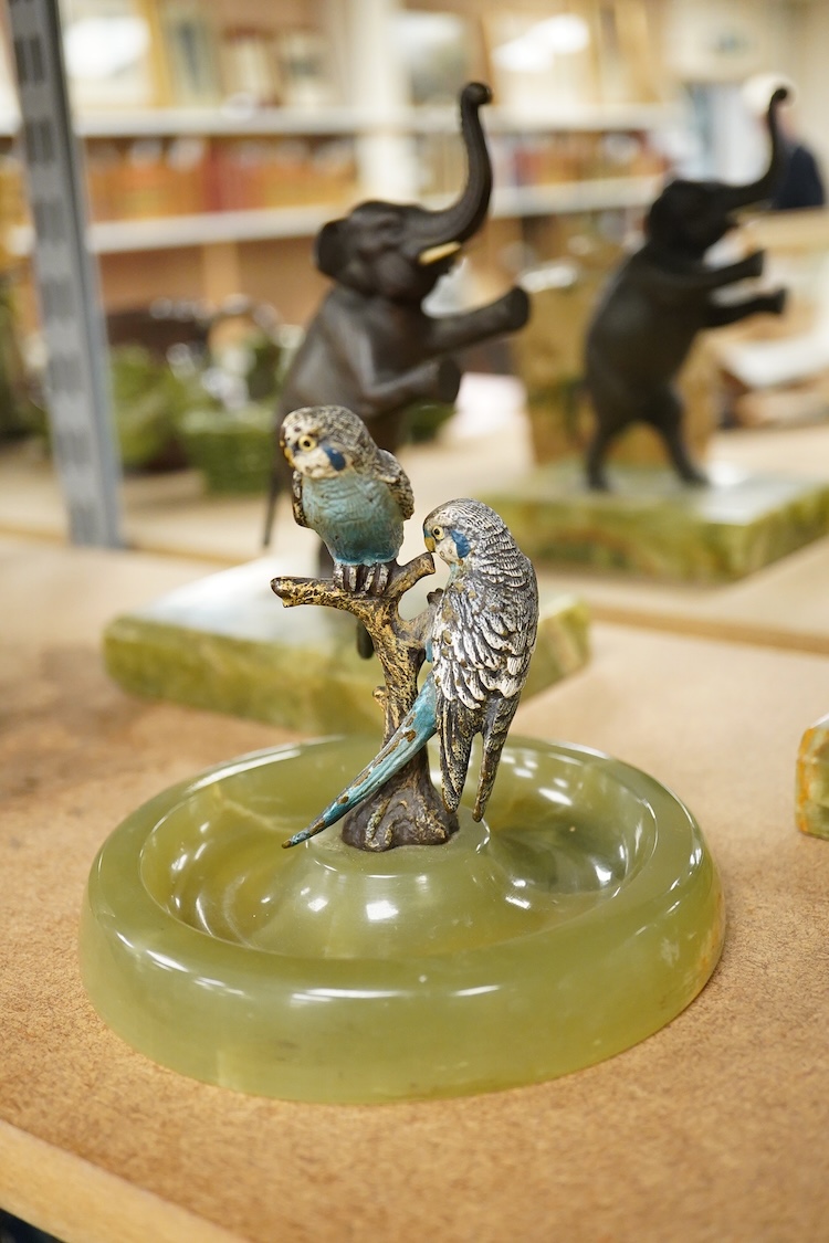 Two Art Deco bronze elephants and a cold painted bronze parakeet group, all on green onyx bases, tallest 17cm